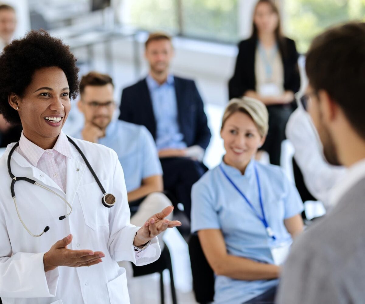 Renew Medical clinician with patient
